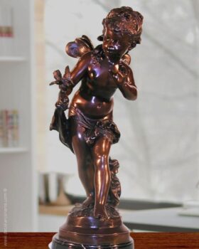 Figure of bronze. Girl with bird. 73 x 27 x 25 cm.