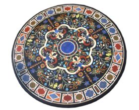 Tablero geométrico de mesa redondo en mosaico de piedras duras